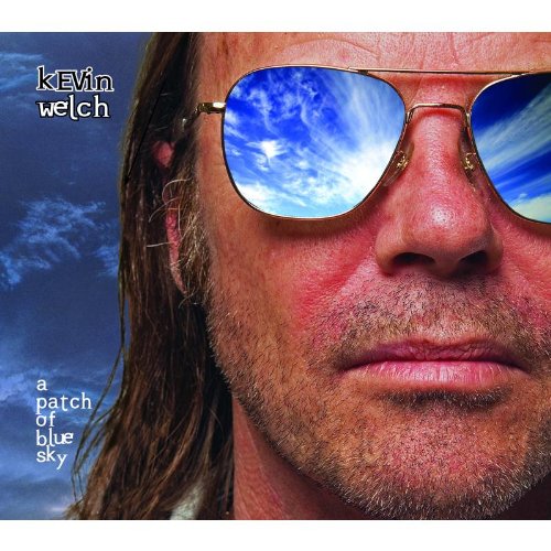 Man wearing sunglasses with blue sky reflection on album cover "A Patch of Blue Sky".