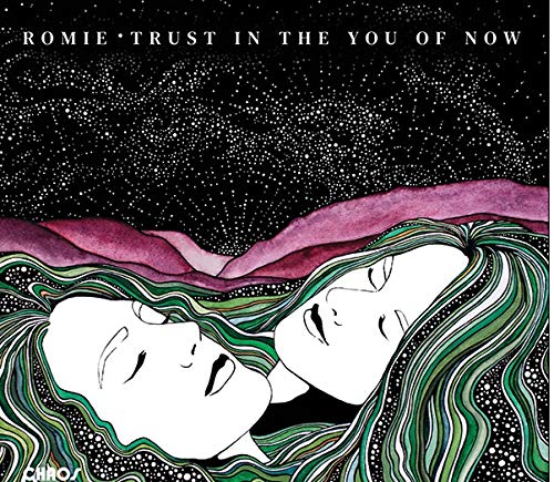 "CD cover art featuring two white faces with flowing green hair against a starry night sky."