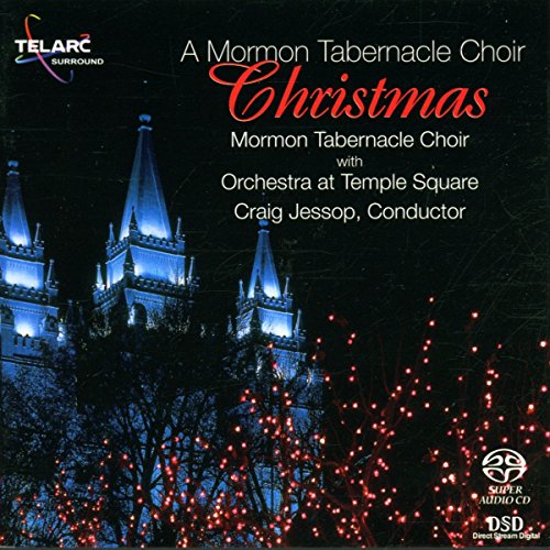 "CD cover featuring a lit temple at night with red lights in foreground."