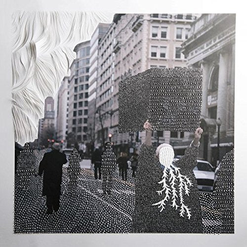 "Black and white vinyl record cover featuring a city street scene with silhouetted figures."
