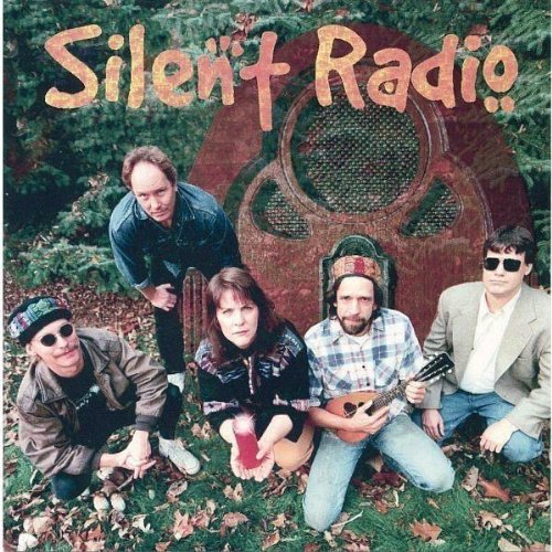 "Album cover with five men posing outdoors, holding instruments, and wearing sunglasses."