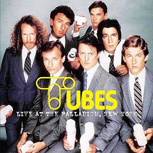 "CD cover featuring seven suited men holding tubes, with text 'Tubes Live At The Palladium'."
