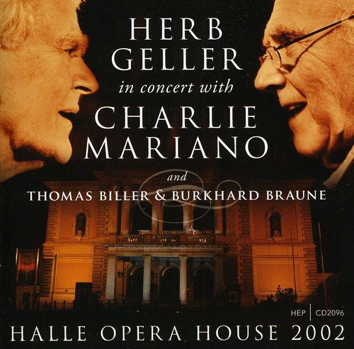 CD cover with two men's profiles and opera house at night.