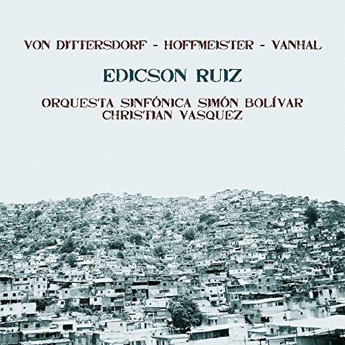 "CD cover with a black and white cityscape image and red and blue text."