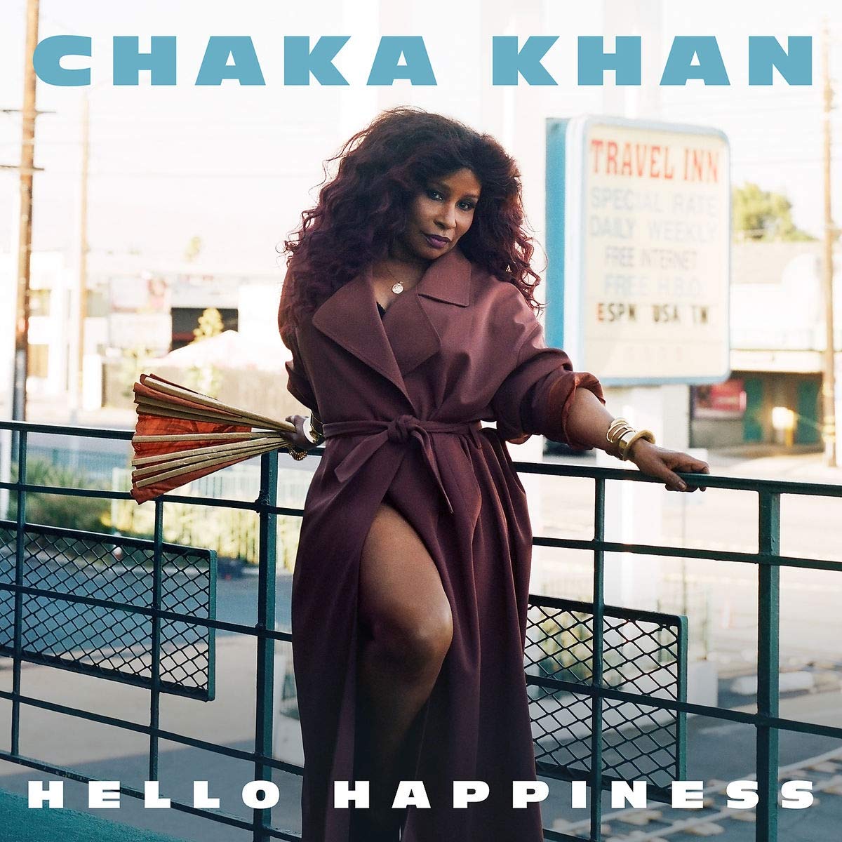 Chaka Khan album cover featuring a woman in a long coat holding an umbrella.