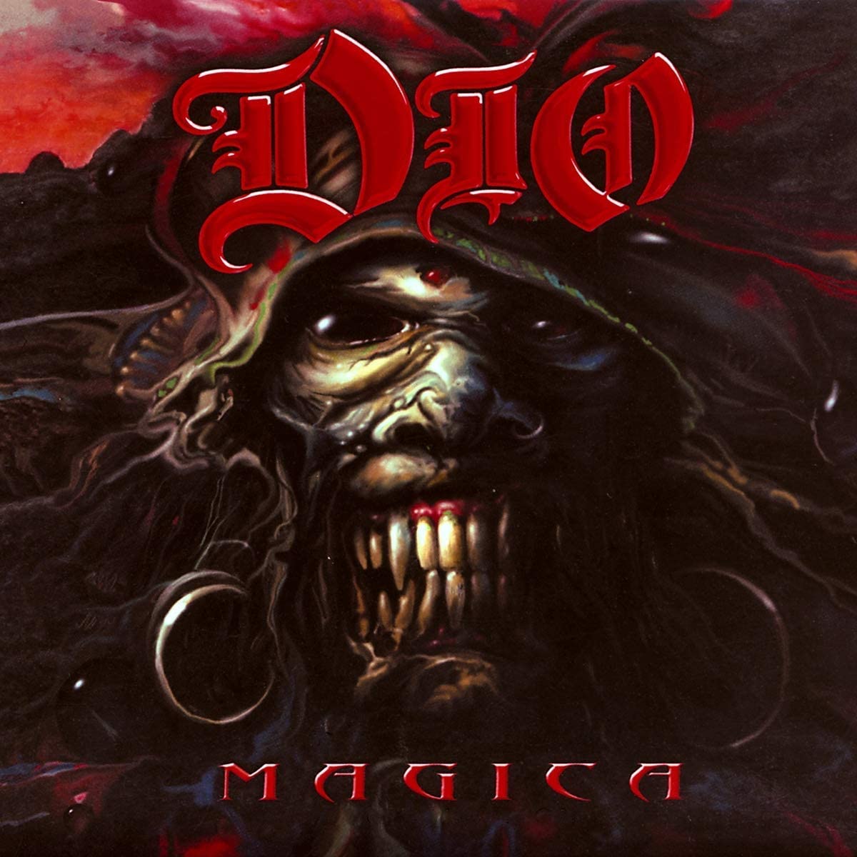 "Dio - Magica" album cover featuring a hooded, grotesque figure with sharp teeth.