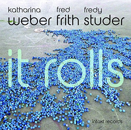 "Album cover with blue beads on concrete, artist names, and record label logo."