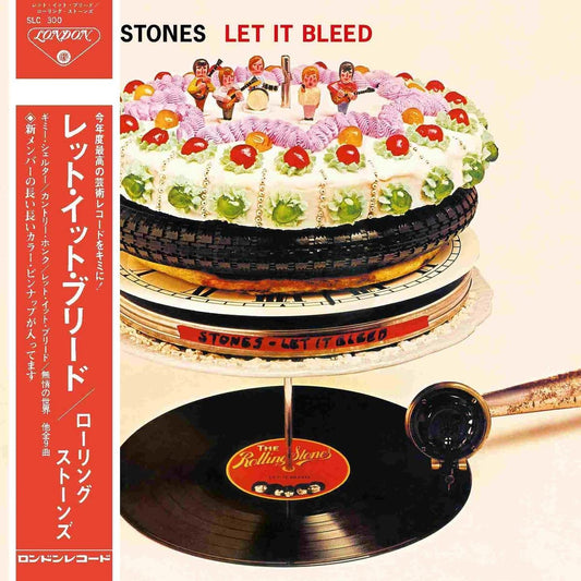 The image shows the Rolling Stones' "Let It Bleed" album cover, featuring a multi-layered cake resembling stacked vinyl records, with a gramophone playing a record below.