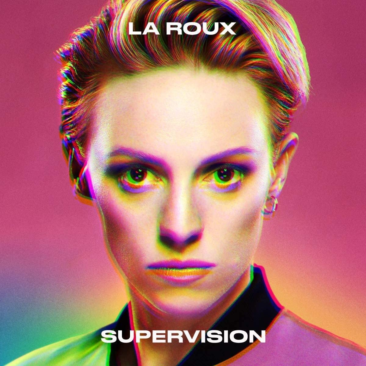 Album cover with a woman's face and text "La Roux Supervision" on a rainbow background.