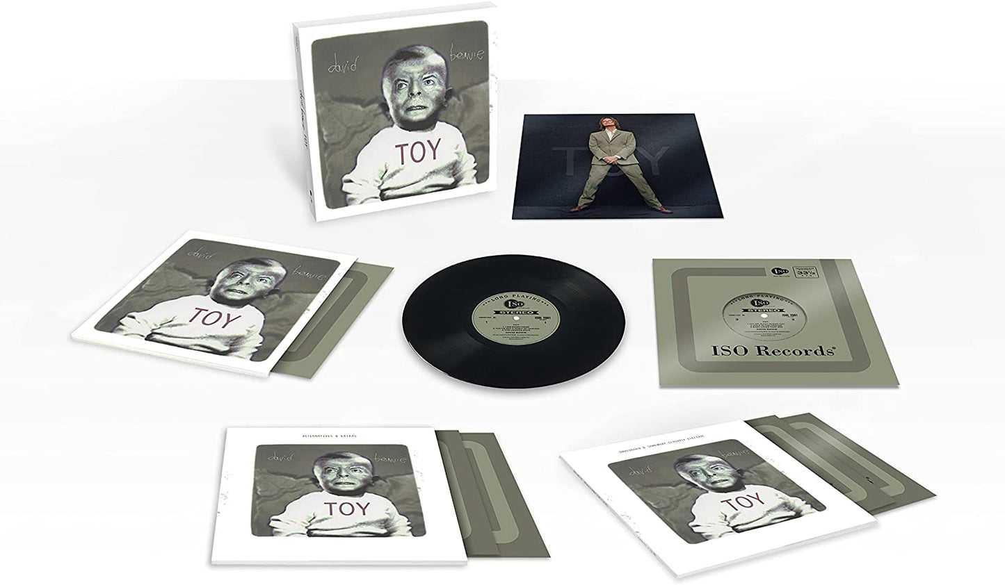 David Bowie vinyl record and box set with multiple booklets and a CD.