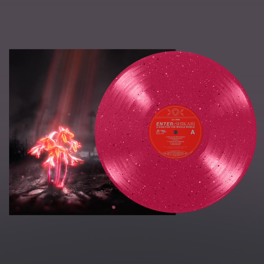Pink vinyl record with speckles and album cover featuring glowing flowers.