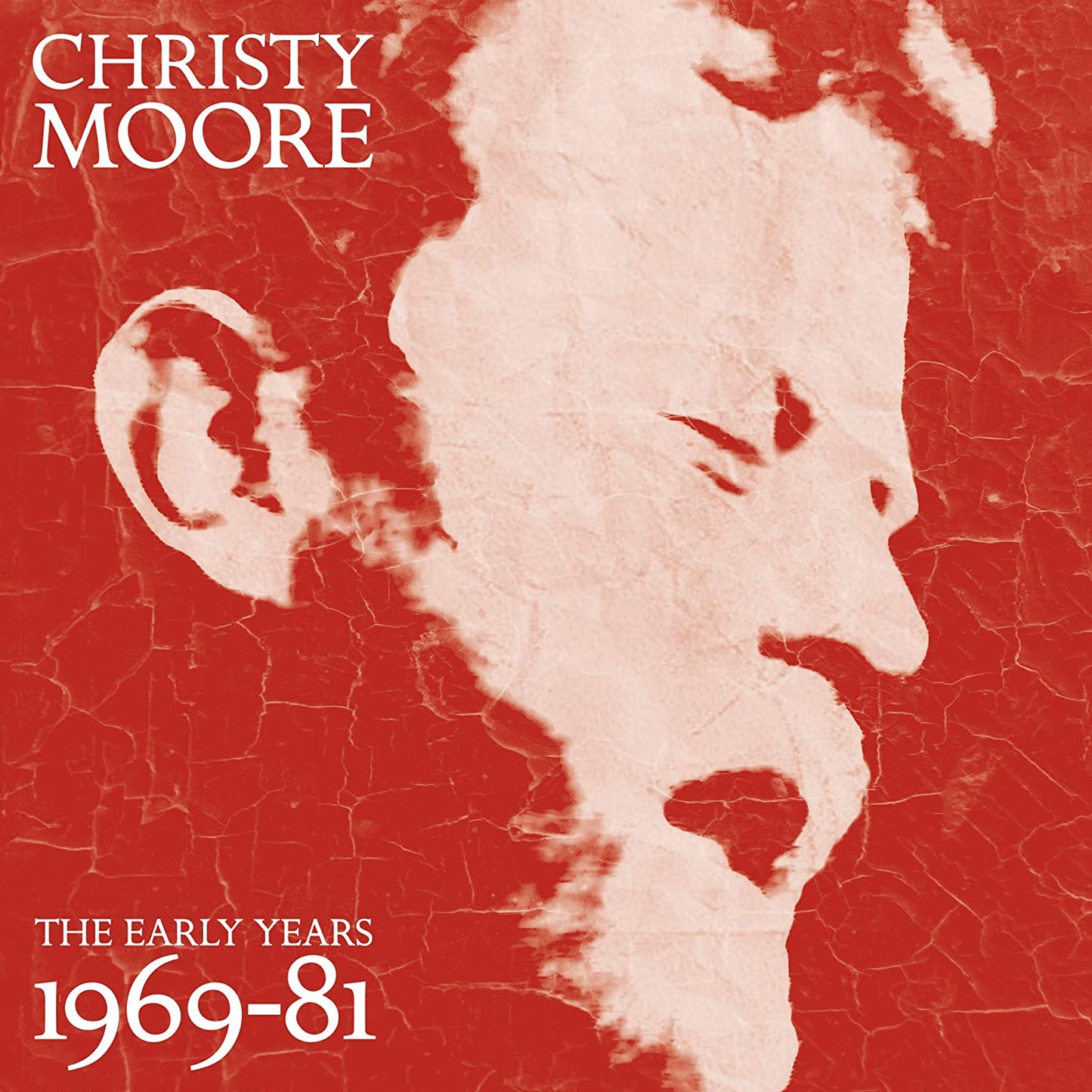 "Album cover with a black and white image of a man's face and white text."