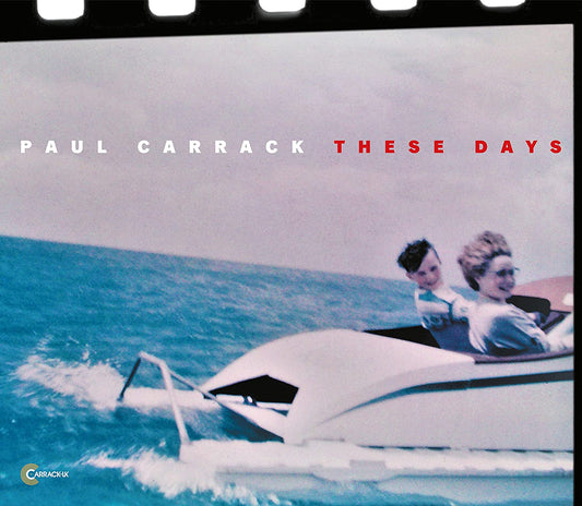 Album cover with two people in a speedboat on blue water.