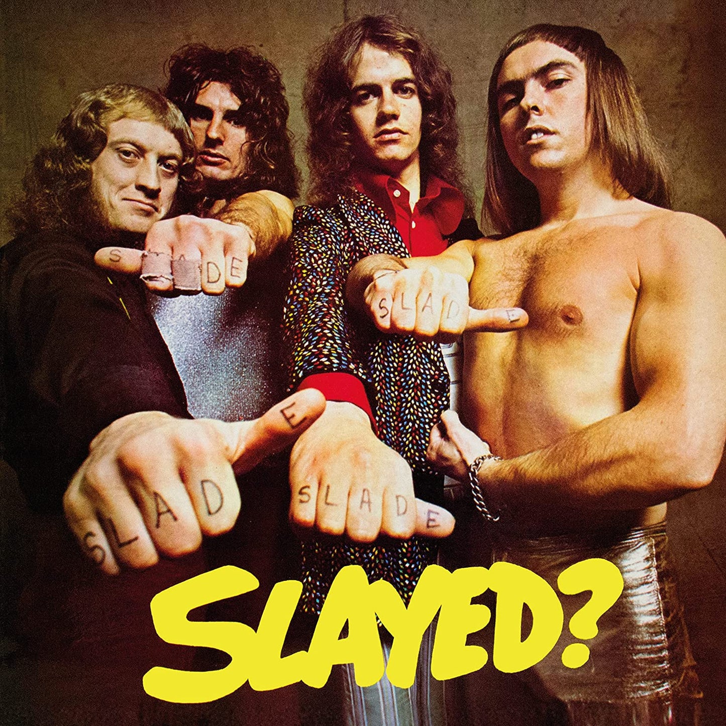 "Album cover of Slade's 'Slayed?' featuring the band members pointing with 'SLADE' on fingers."